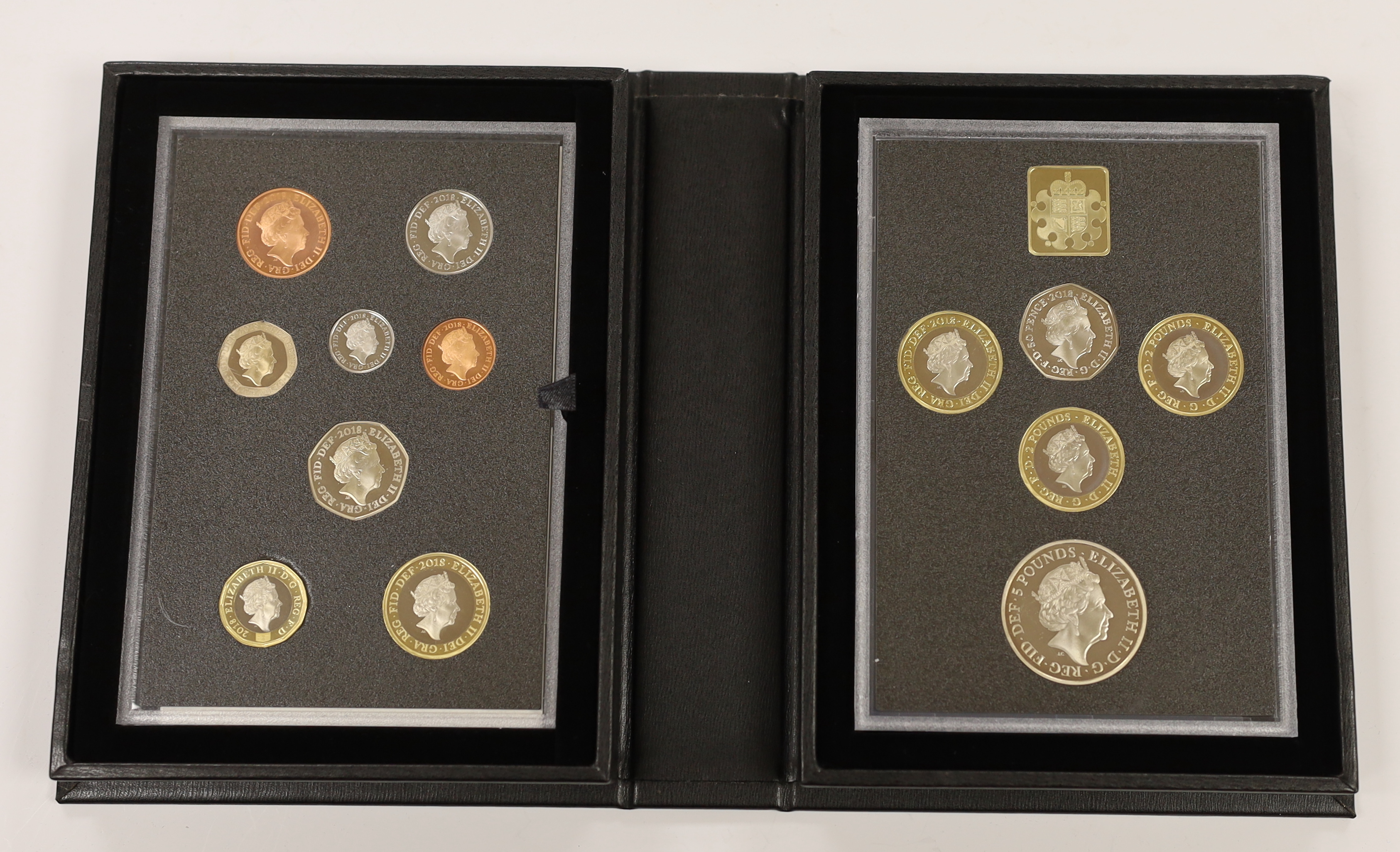 Two Royal Mint UK QEII Proof coin sets for 2018 and 2019, each containing definitive and commemorative coins, 2 cases